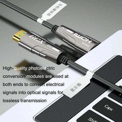 High-Performance HDMI Active Optical Cable for 4K Displays connected between laptop and 4K display showing slim metal HDMI connectors and labeled cable