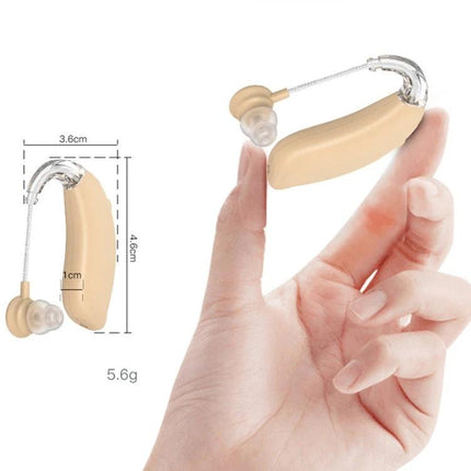 Rechargeable Hearing Aid for Clear Everyday Sound Support in beige shown held between fingers, compact rechargeable behind‑ear device with tubing and ear dome