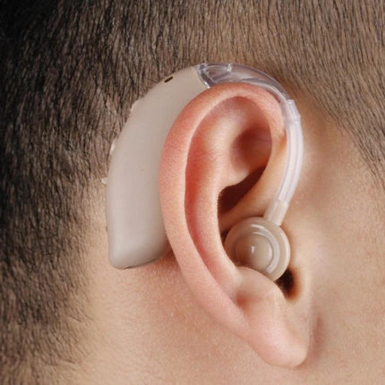 Ear-Hook Rechargeable Noise Cancelling Hearing Aid for Seniors positioned over ear showing ear-hook design and discreet beige rechargeable device