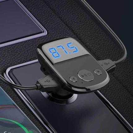 Car Charger With Bluetooth FM Transmitter And Digital Display showing 87.5 MHz, USB ports and control buttons on car dashboard