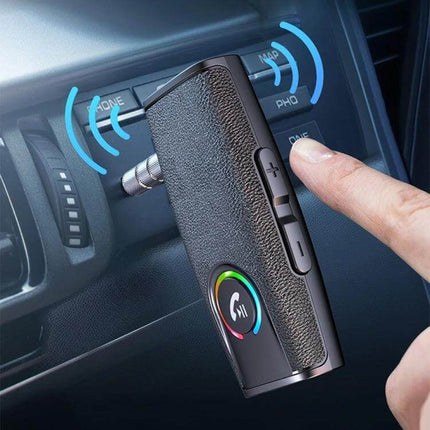Car Bluetooth Receiver For In Car Audio Wireless Adapter plugged into AUX with USB-C charging, volume buttons and hands-free call button