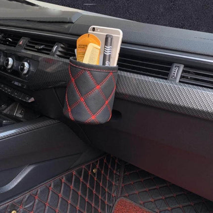 Leather Car Air Vent Organizer For Small Everyday Items In Your Car - black leather pocket with red stitching holding phone, comb, and pen on car air vent