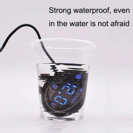 Motorcycle Battery Voltage Monitor With Smart Voltage Meter showing waterproof digital display submerged in cup for 9–24V systems