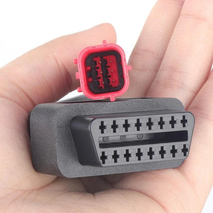 Honda Adapter Cable for Everyday Motorcycle Maintenance - close-up of red plug and black connector in hand, diagnostic adapter for Honda bikes