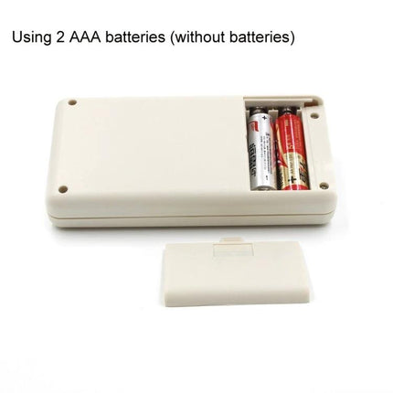 Integrated Circuit Tester for Transistors and Chips portable unit showing battery compartment with two AAA batteries and removed cover