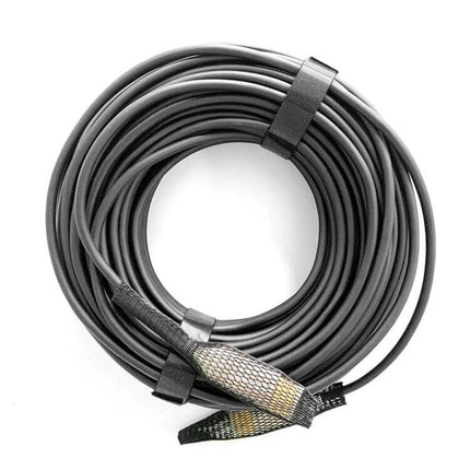 Fiber Optical HDMI Cable for Long-Distance Device Connections coiled black cable with braided connector sleeves for 4K home theater and presentation use