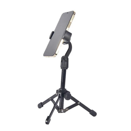 Versatile Desktop Tripod Stand for Microphones and Devices holding a phone on a foldable metal desktop tripod for stable hands-free use