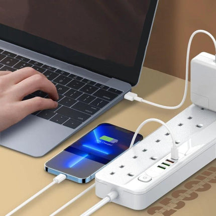 LDNIO Multifunctional Travel Charging Socket for Home and Office plugged into power strip charging phone and laptop