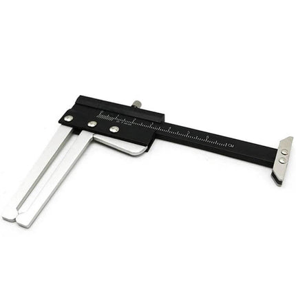 Steel Tire Tread Depth and Width Measuring Gauge showing black steel caliper with dual prongs for measuring tire tread depth and width