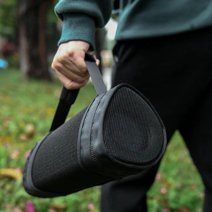 Sony Padded Speaker Carrying Bag For Everyday Outings shown carried outdoors protecting Sony SRS-XB43 during park picnic