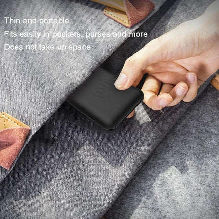 Portable Folding Phone Stand and Wireless Charger for Daily Use shown thin and pocket‑friendly being slipped into a bag, compact 5.7 x 8.55 x 1 cm, 28 g