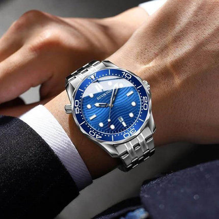 BINBOND Luminous Men's Sports Watch For Everyday Use on wrist with blue dial, 44mm metal case and steel strap, luminous hands for quick time reading