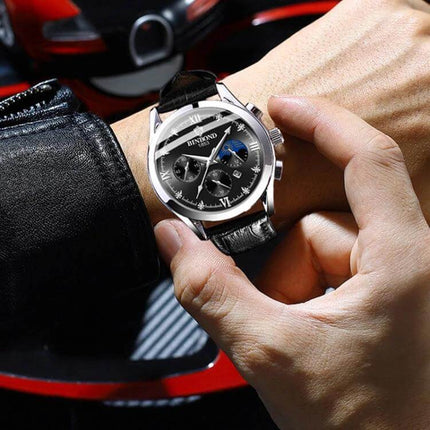 Binbond Waterproof Luminous Men's Calendar Watch on wrist with black leather strap, metal case, luminous hands and calendar display