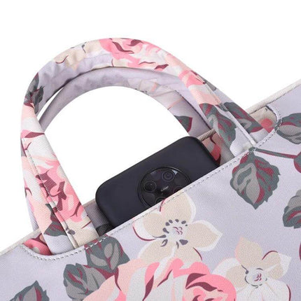 White Rose Pattern Protective Laptop Bag with Handle for 13-15 Inch Devices showing floral handles and top pocket with phone
