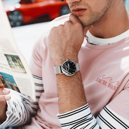 BINBOND Luminous Starry Design Watch for Everyday Wear shown on man’s wrist with starry black dial and luminous hands