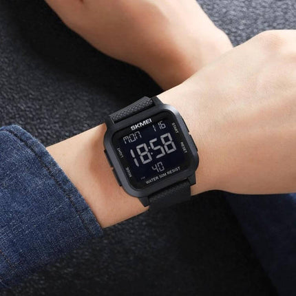 SKMEI Square Waterproof Sports Watch for Daily Activities on wrist showing square digital display and durable strap