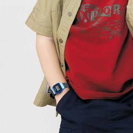 Child wearing a blue SKMEI Luminous Waterproof Multifunctional Children's Sports Watch showing digital display for school and play