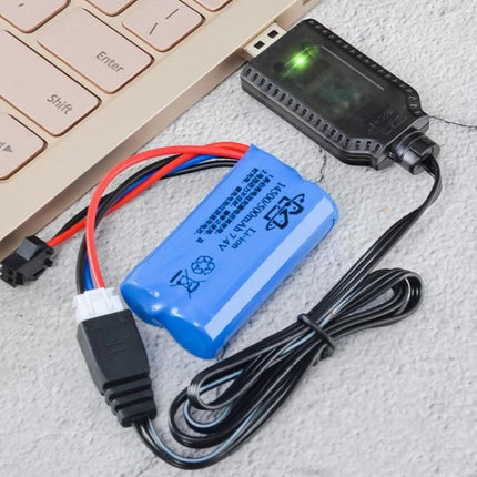 7.4V Lithium Battery USB Charger for Toys and Appliances connected to a laptop charging a blue 7.4V battery with indicator light