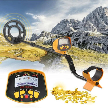 Handheld Metal Detector for Finding Buried Metals Outdoors with control panel, coil and found gold coins in mountainous field