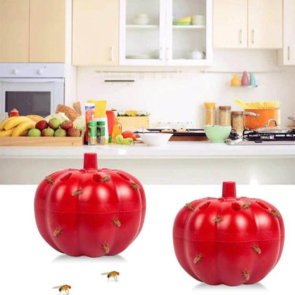 Red Pumpkin Fruit Fly Traps 2 Pack for Kitchen and Home shown on countertop near fruit bowls in bright kitchen