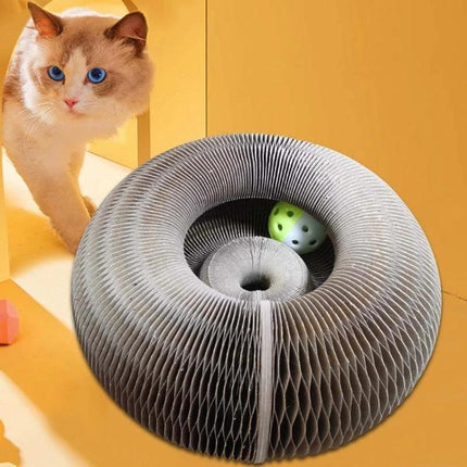 Versatile Organ-Shaped Scratching Board for Cats at Home - corrugated paper donut scratcher with toy ball near curious cat