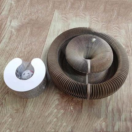 Versatile Organ-Shaped Scratching Board for Cats at Home placed on wooden floor showing corrugated-paper spiral design
