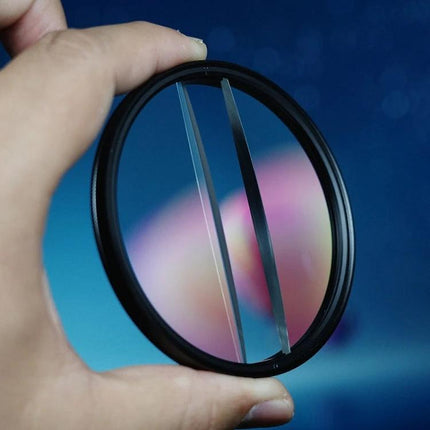 Double Half Moon Foreground Blur Filter for Photography held up to show dual optical glass halves and refraction effect for in-camera foreground blur