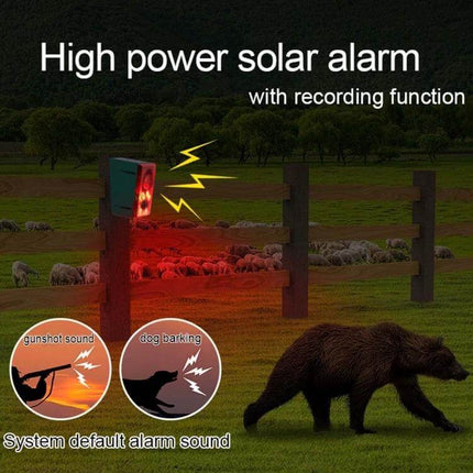 Solar Animal Repeller with Sound and Light for Outdoor Use positioned on fence emitting red light and alarm to deter foxes and birds