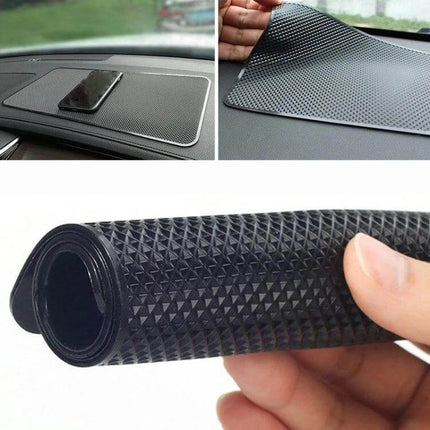 Car Anti Slip Mat For Center Console And Instrument Panel Medium placed on dashboard holding phone and rolled textured PVC mat