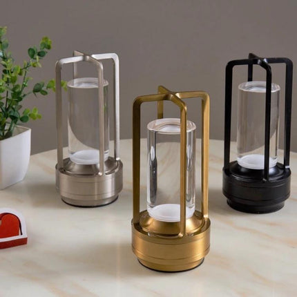A Lamp That Lights Up Your Home and Camping Nights Easily - portable metal lanterns in gold, silver, and black on table