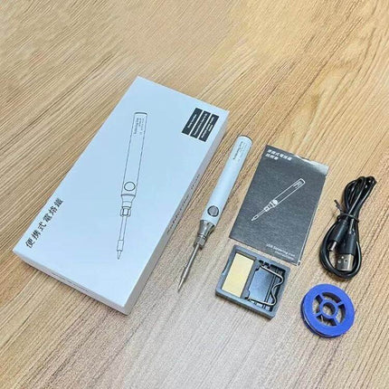 USB Cordless Soldering Pen For Small Electronics And DIY Projects shown with USB cable, soldering tips, sponge and packaging on wooden table