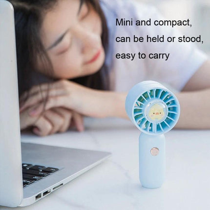 Handheld Mini Fan with Duck Design for Portable Cooling shown on desk near laptop with woman relaxing