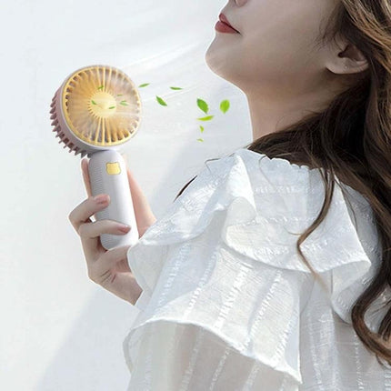 Compact Portable Handheld Electric Fan for Everyday Cooling held by woman providing personal airflow during outdoor use