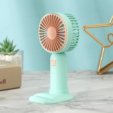Handheld Portable Fan for Everyday Cooling and Travel Use compact mint handheld fan with stand and phone holder feature