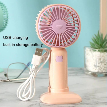 Handheld Portable Fan for Everyday Cooling and Travel Use - Pink compact rechargeable fan with USB cable and detachable base that doubles as phone stand