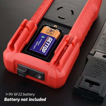 TASI Digital Multimeter for Household Electrical Testing showing open battery compartment with 9V battery installed in red handheld meter