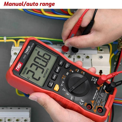 TASI Digital Multimeter for Household Electrical Testing showing 230.6V measurement in hand testing wall circuit