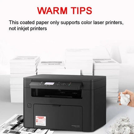 A4 High Gloss Coated Paper for Double-Sided Color Laser Printing shown with color laser printer and stacks of printed photo-quality documents