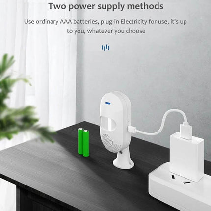 Tuya App-Controlled Wireless Motion Sensor for Home Security on table showing AAA battery and USB power options