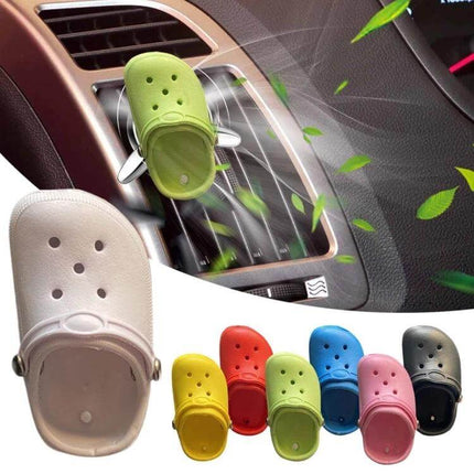 Cute Shoes Shape Car Air Vent Ornament With Aromatherapy clipped to vent releasing fresh fragrance in colorful shoe-shaped diffuser