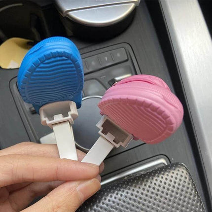 Cute Shoes Shape Car Air Vent Ornament With Aromatherapy shown in blue and pink clipped onto car vent for scent diffusion