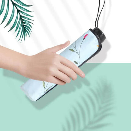Folding Dual-Purpose Sun Umbrella for Everyday Outdoor Use compact floral folding umbrella in hand for sun and rain protection