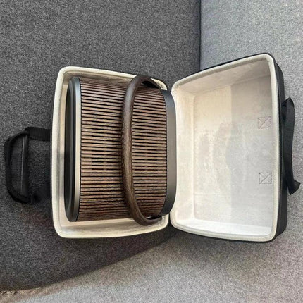 Beosound A5 Hard Shell Protective Travel Case With Lining showing speaker inside, molded exterior and soft interior, carry handle
