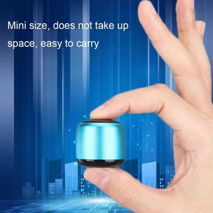 Compact Bluetooth Speaker For Travel And Daily Listening small metallic blue pocket speaker held between fingers for commuting