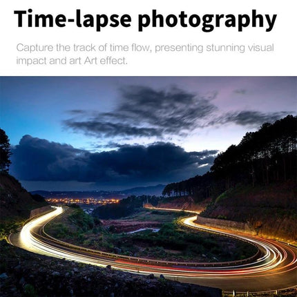 5K Sports Camera for High-Resolution Outdoor Adventures capturing time-lapse night road with winding light trails and mountain landscape