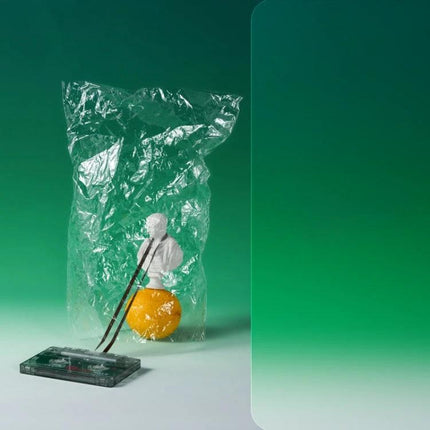 78x106cm Gradient Background Paper for Portrait Photography green gradient studio backdrop with wrapped bust, orange prop and cassette tape