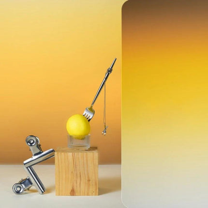 Gradient Background Paper for Portrait Photography, 106x144cm showing yellow-orange gradient backdrop with minimalist product still life