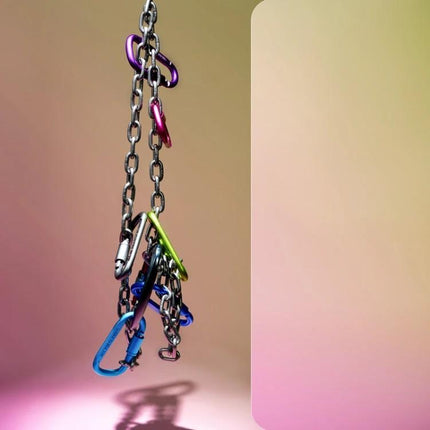 Gradient Background Paper for Portrait Photography, 106x144cm with hanging colorful carabiners and chains on soft pink-green gradient backdrop