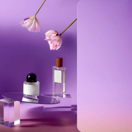 Gradient Background Paper for Portrait Photography, 106x144cm showcasing perfume and flowers on a smooth purple gradient backdrop