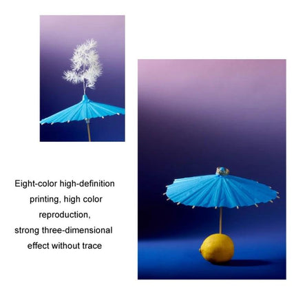 Gradient Background Paper for Portrait Photography, 106x144cm showing blue umbrella prop and lemon on smooth purple-blue gradient backdrop